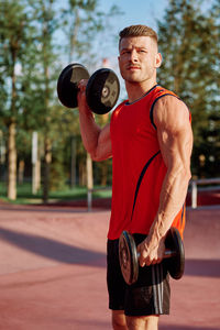 Portrait of man exercising in gym