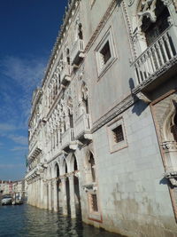 Low angle view of buildings against sky in city