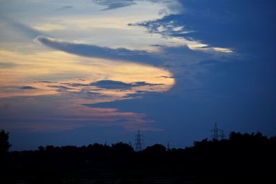 Low angle view of silhouette trees against sky during sunset