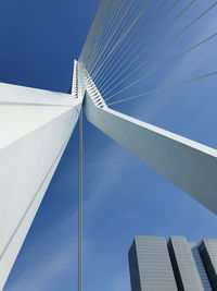 Low angle view of modern building against blue sky