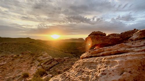 Scenic view of landscape against sky during sunset