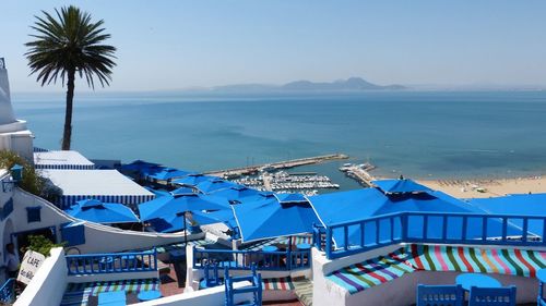 High angle view of swimming pool by sea against sky