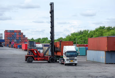 View of industry against cloudy sky