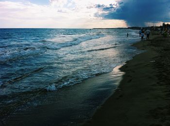 Scenic view of sea against cloudy sky