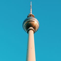 Low angle view of alexanderplatz against clear blue sky