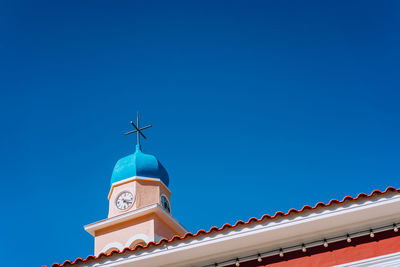 Low angle view of building against blue sky