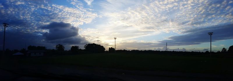 Silhouette trees against sky during sunset