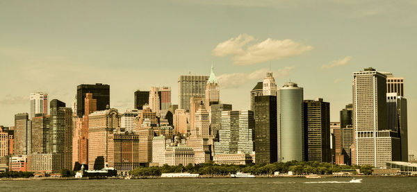 Modern buildings in city against sky