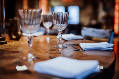 Close-up of wineglasses on table