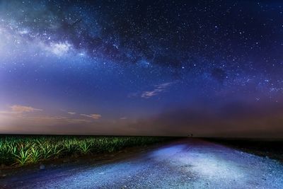 Scenic view of field against sky at night