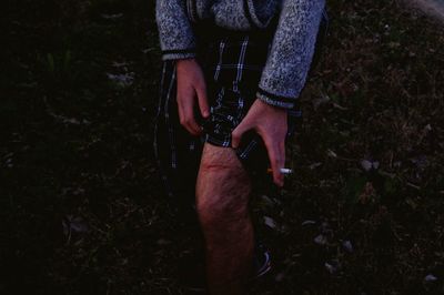 Midsection of man showing injured leg