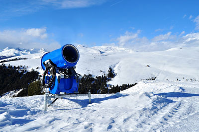 Machinery on snowcapped mountain