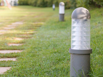 Close-up of lighting equipment on grass at park