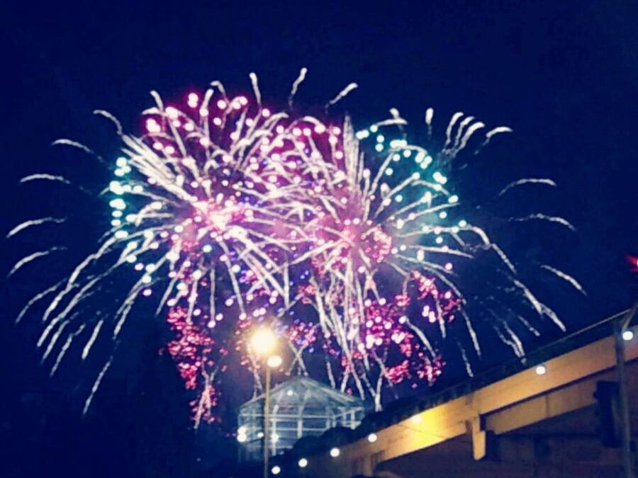 night, illuminated, firework display, celebration, exploding, arts culture and entertainment, glowing, long exposure, firework - man made object, event, motion, sparks, low angle view, entertainment, sky, firework, blurred motion, multi colored, celebration event, clear sky