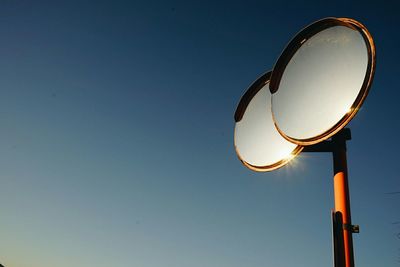 Low angle view of basketball hoop against clear sky