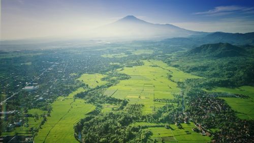 Aerial view of agricultural field against sky