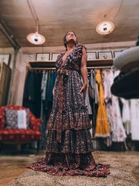 Full length of woman standing in store