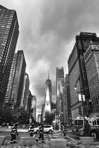 View of city street and buildings against sky