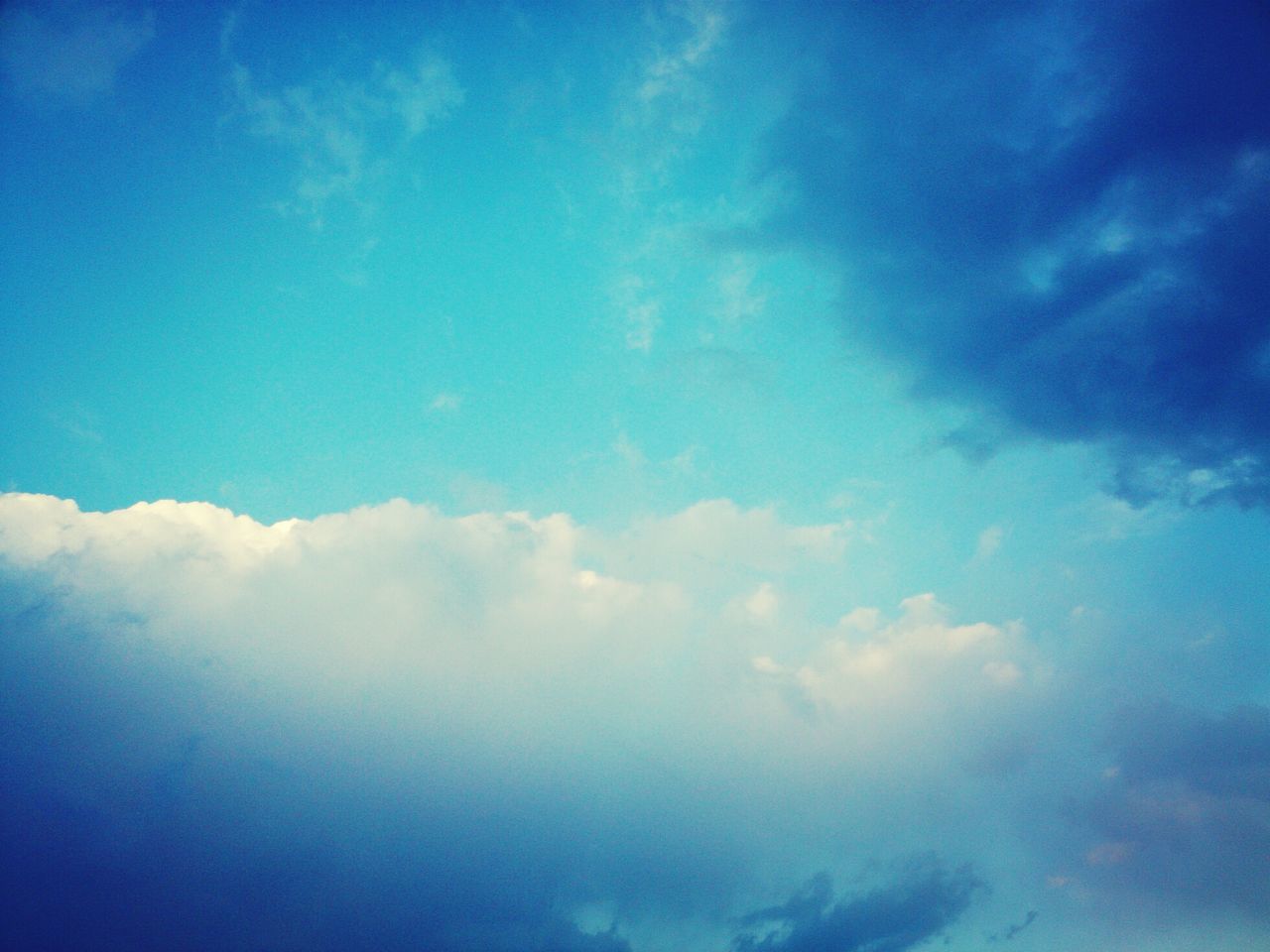 blue, sky, low angle view, cloud - sky, beauty in nature, tranquility, scenics, sky only, tranquil scene, nature, cloud, cloudscape, cloudy, idyllic, backgrounds, outdoors, no people, day, majestic, white color