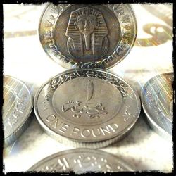 Close-up of coins on table