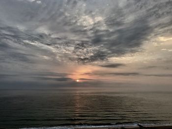 Scenic view of sea against dramatic sky