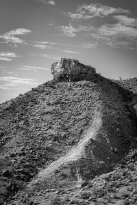 Low angle view of rock formations against sky