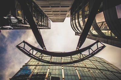 Low angle view of building against cloudy sky