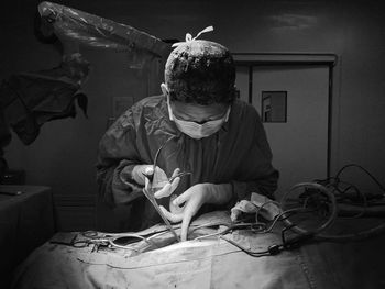 Surgeon performing surgery at hospital