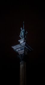 Low angle view of statue at night