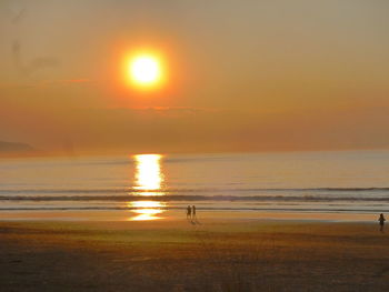 Scenic view of sea at sunset