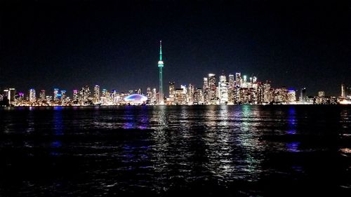 Illuminated buildings in city at night