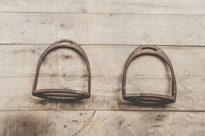 Close-up of metal handles on wood