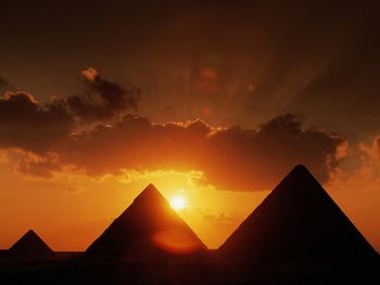 Silhouette of building during sunset