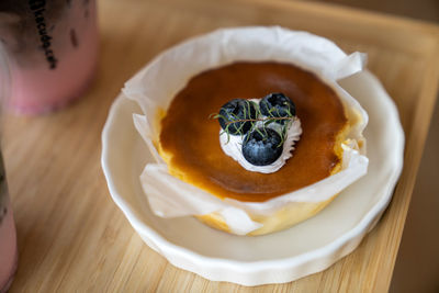 Close-up of blue berry cheese cake in plate on table