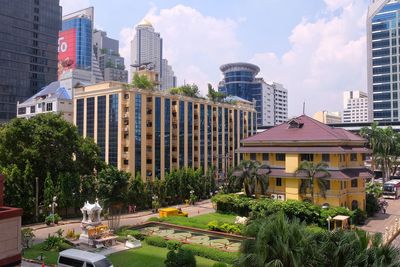 Buildings in city against sky