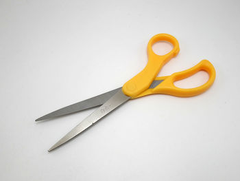 High angle view of yellow pencils on white background