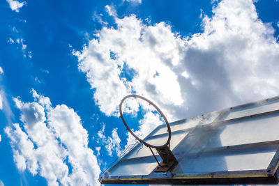 Low angle view of ferris wheel against sky