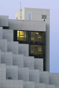 Building against sky seen through glass window