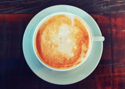 Directly above shot of coffee cup on table