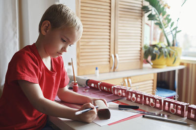 Boy looking at camera at home