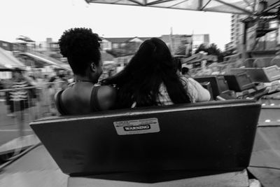 Rear view of people sitting in bus