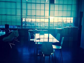 Empty chairs and table in office