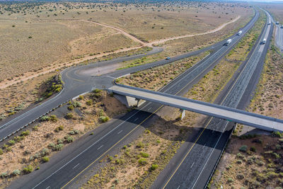 High angle view of highway by railroad tracks