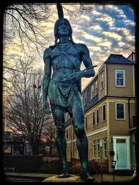 Low angle view of statue against sky