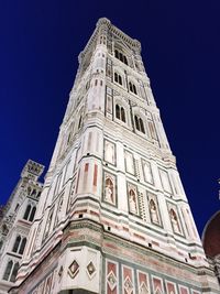 Low angle view of building against blue sky