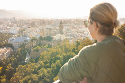 Side view of woman looking at mountain