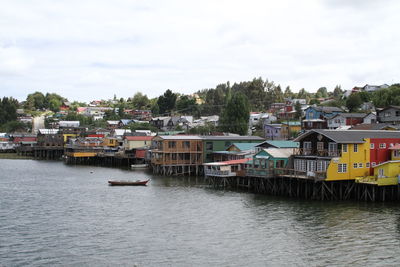 High angle view of town against cloudy sky