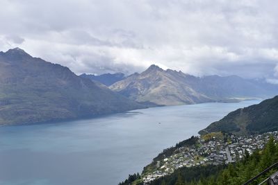 Scenic view of mountains against cloudy sky