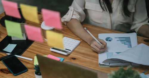 High angle view of woman sitting on table