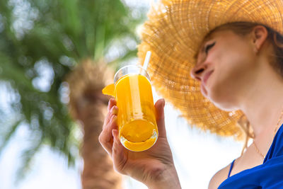 Close-up of hand holding drink